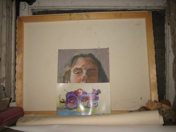 Perched on a shelf in Jeff Myers' studio is a self portrait painted several years ago with a small version "Tractor Amalgam."